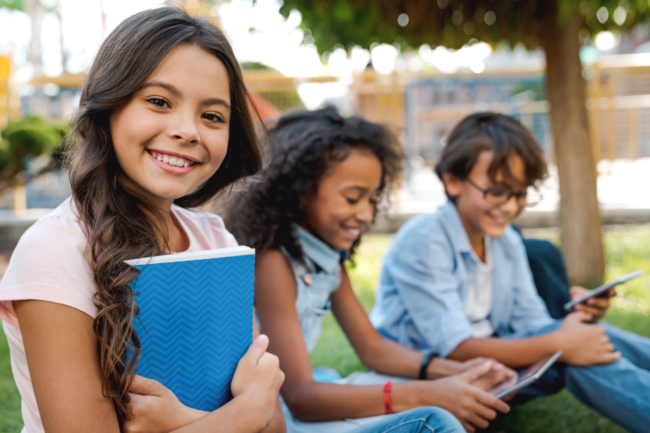 Portrait,of,cute,little,school,girl,and,childrens,on,background